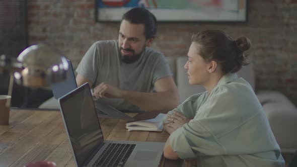 Friends are Working Together on a Common Project Smiling and Laughing alt