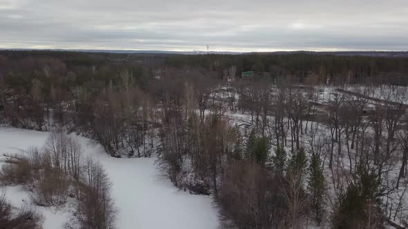 Skiing Lodge in Forest in Winter Time, Aerial View, Cloudy Weather