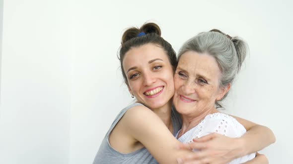 Happy Senior Mother is Hugging Her Adult Daughter the Women are Laughing Together Sincere Family of alt