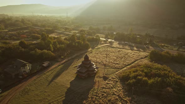 Aerial Ukrainian Historical Wooden Church in Old Village alt