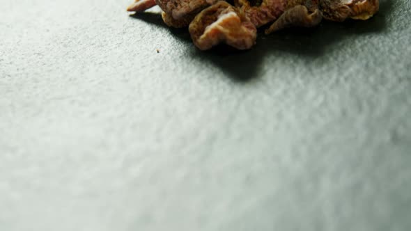 Dried berries on grey background 4K 4k alt
