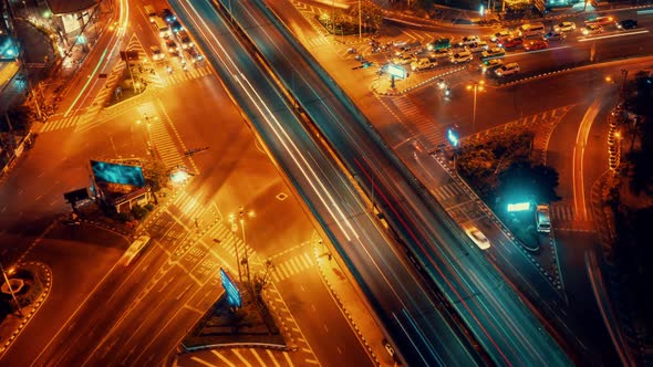 Time Lapse of Busy Highway Road Junction in Metropolis City Center at Night alt