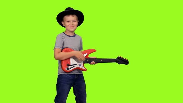 Happy Little Boy Playing Guitar