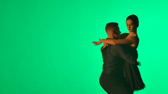 Passionate Young Woman Beckons Her Partner and They Begin to Dance Tango alt