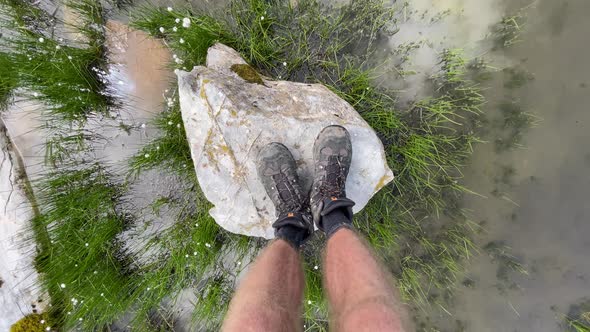 Hiker balancing on rock at Rautispitz Switzerland gopro shot alt