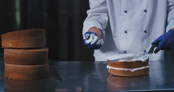 This Baker Man Is Using His Clean Hand To Hold alt