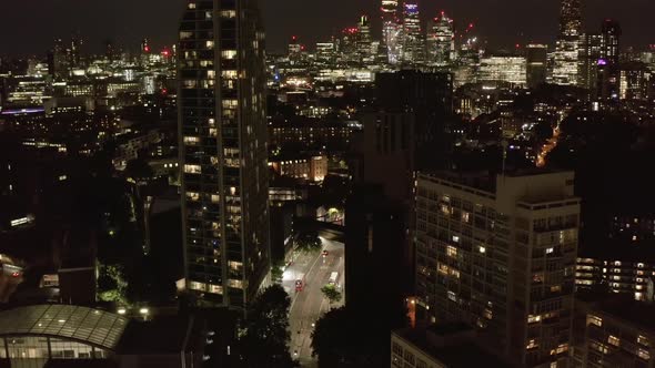 Tilt Up Reveal of Downtown Skyscrapers at Night alt