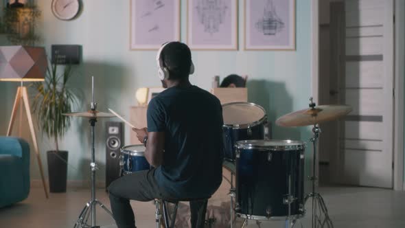 Black Drummer Rehearsing at Home alt