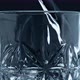 Closeup Water Pouring Glass with Splashing Dark Background - VideoHive Item for Sale