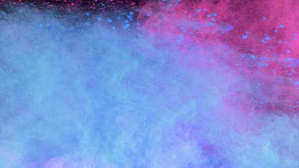 Super Slowmotion Shot of Color Powder Explosion Isolated on Black Background alt