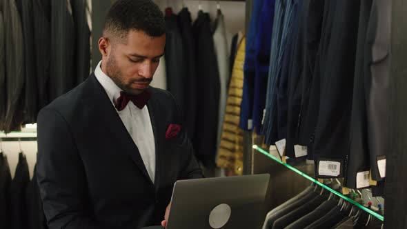 Charismatic Designer Man in a Luxury Suit Shop