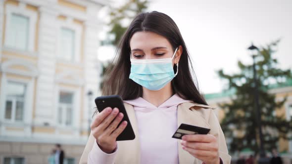 Woman Shopping Online with the Phone Application Using Credit Card alt