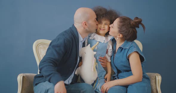 Happy family Dad and mom are playing with their daughter Turkish family alt
