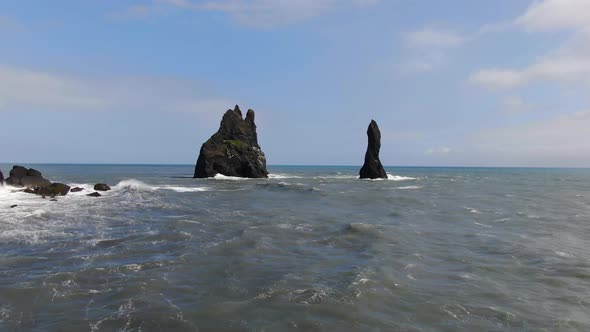 Aerial view of Reynisdrangar basalt sea stacks near Reynisfjara beach, Iceland alt