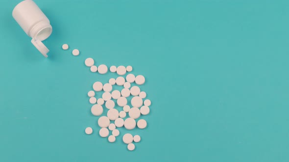 4K Stop motion animation of white pill on blue background alt