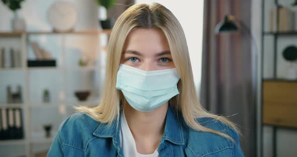 Female Facial Portrait in Protective Mask During Self-Isolation alt