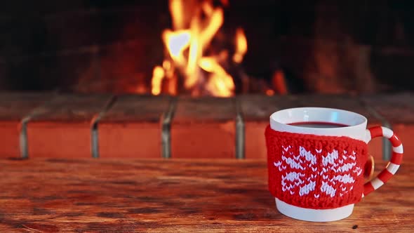 Christmas Cup Of Mulled Wine Near Fireplace. Winter Holiday Xmas And New Year