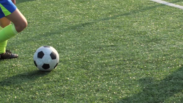 Soccer Forward Dribbling Ball and Scoring Goal alt