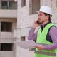 Young Engineer Working on Building Site  and Giving tasks over the Phone - VideoHive Item for Sale