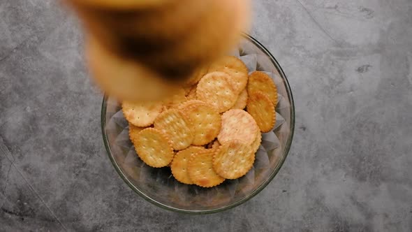 Top view falling Biscuits Cookies into a bowl, Slow motion. alt