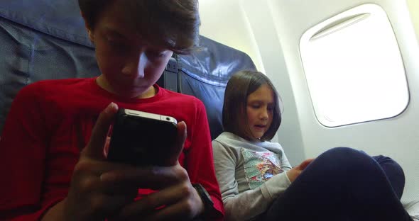 Boy and girl using smart phone