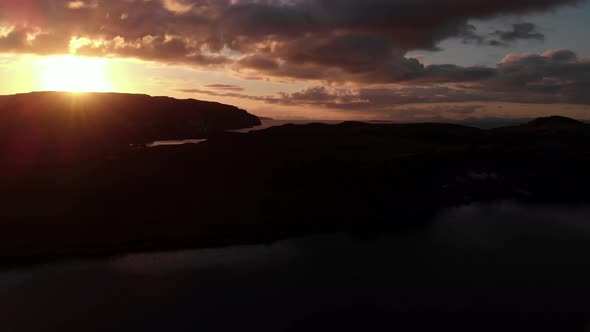 Sunset Isle Of Skye Coastline Panoramic Aerial View Outer Hebrides Mountain Range Cloudy Blue Sky 4K