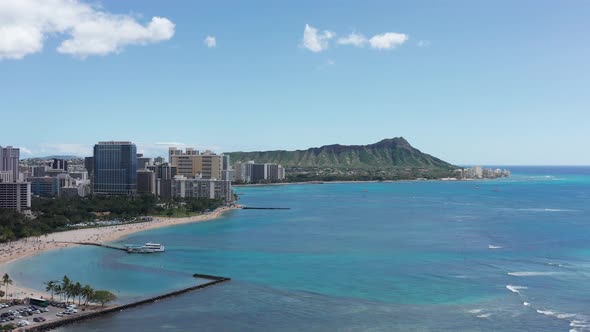 Super wide aerial shot of Waikiki with the Diamond Head monument in the background on the island of alt