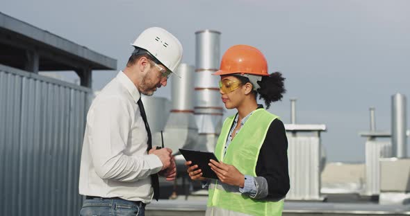 Old Engineer and His Assistance Woman African alt