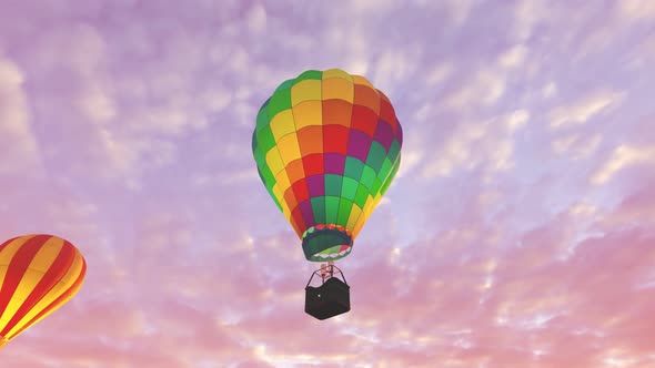 Colorful hot air balloons flying above desert mountain landscape during sunset.