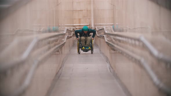 Disabled Man in Wheelchair Getting Up on the Long Special Ramp alt