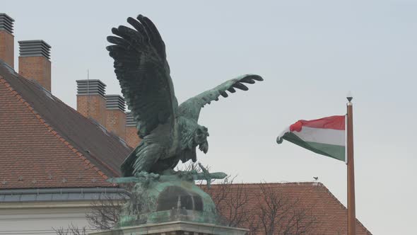 The Turul bird statue and the Hungarian flag