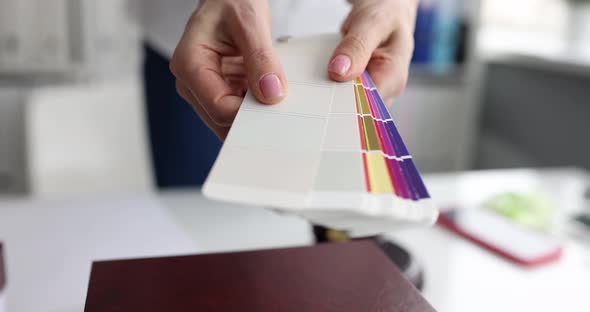 Designer Showing Color Samples for Apartment Decoration Closeup  Movie Slow Motion alt