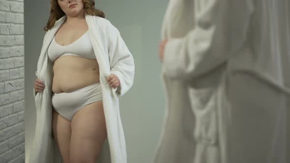 Girl Looking at Her Body After Anti-Cellulite Massage, Wants to See Progress alt