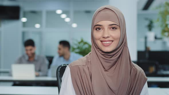 Portrait of Pleasant Smiling Arabian Businesswoman in Hijab Confident Female Insurance Broker Bank alt
