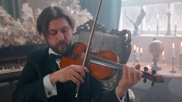 Man On Chair Violin alt