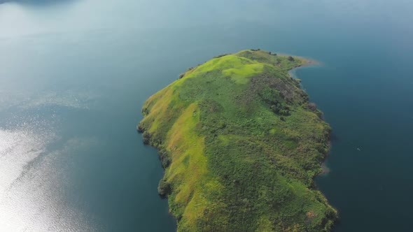 Aerial: flying over lake Toba and Samosir Island Sumatra Indonesia alt