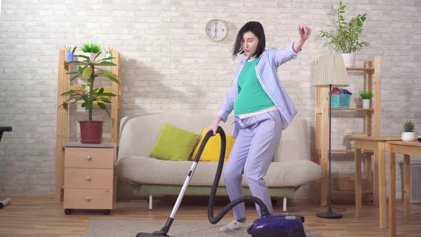 Positive Pregnant Housewife Dancing Doing Her Homework alt