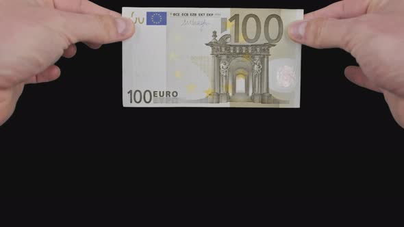 Male Hands Show a Banknote of 100 Euros From Top to Bottom with Alpha Channel alt