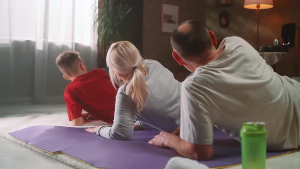 Family Doing Sports at Home Together alt