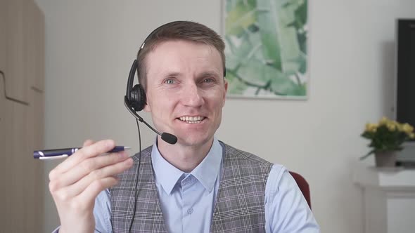 Young Businessman Communicates By Video Link alt
