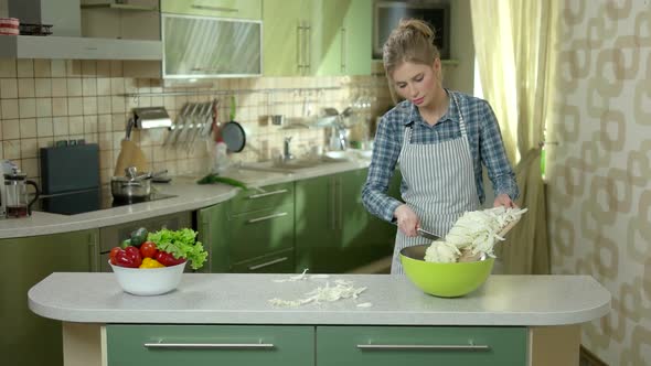 Young Woman in Apron, Kitchen alt