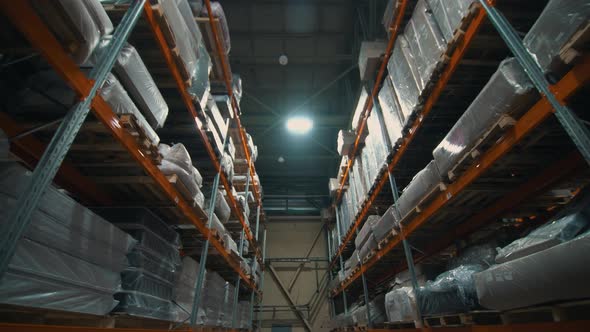 Shelves with Goods in Cardboard Boxes and Packages Full of in Retail Warehouse alt