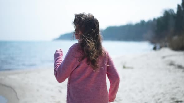 Back View Beautiful Scared Woman Running in Slow Motion Turning Looking Back alt