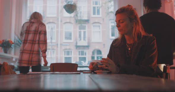 Classy woman taking a sip of espresso alt