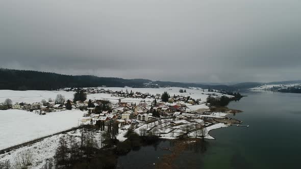 Village of Saint-Point-Lac in Doubs in France seen from the sky alt