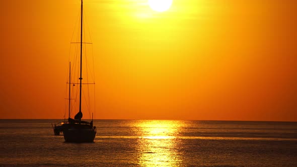 Sail boat in tropical sea at beautiful sunset or sunrise sky alt