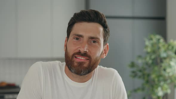 Playful Handsome Gay Looking at the Camera Bites His Lips to the Camera and Shows Hairy Kisses alt