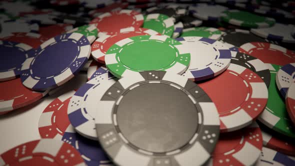 Jackpot. Casino chips formed a big pile on a gaming poker table. Loopable video alt