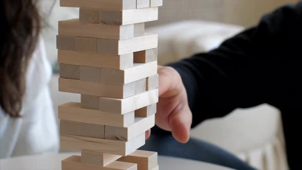 Family Is Playing in Wooden Tower at Home