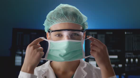 female doctor putting the protective mask on